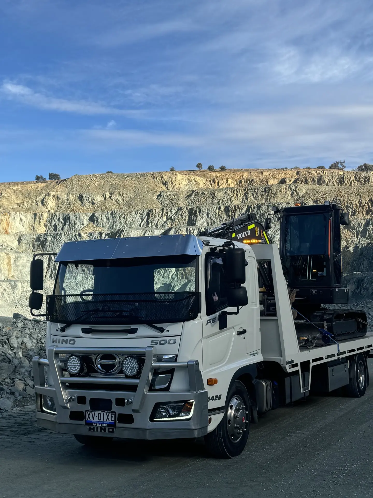 Fuso truck with an excavator loaded at a quarry near Queanbeyan
