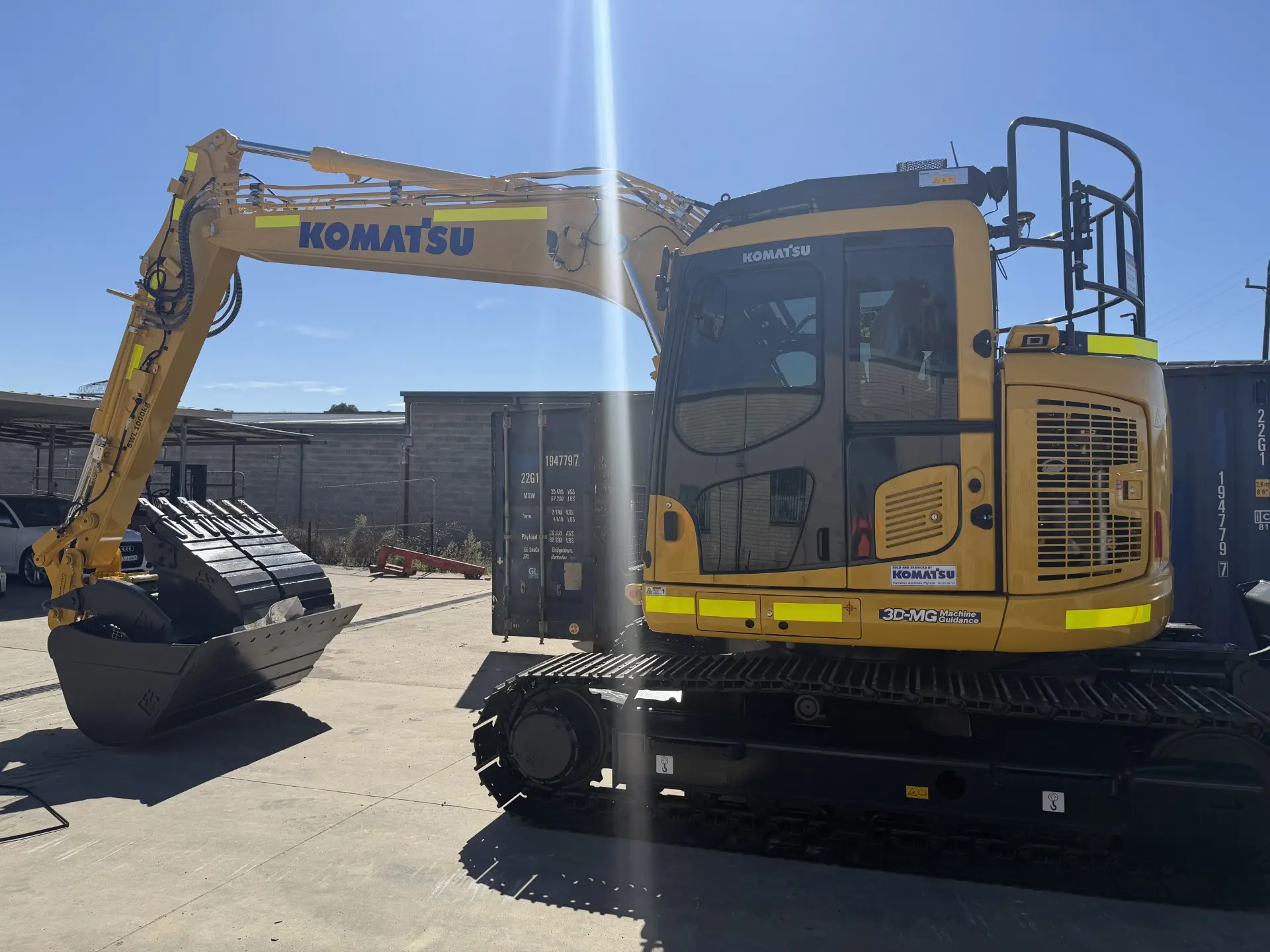 Yellow excavator parked and ready for hire