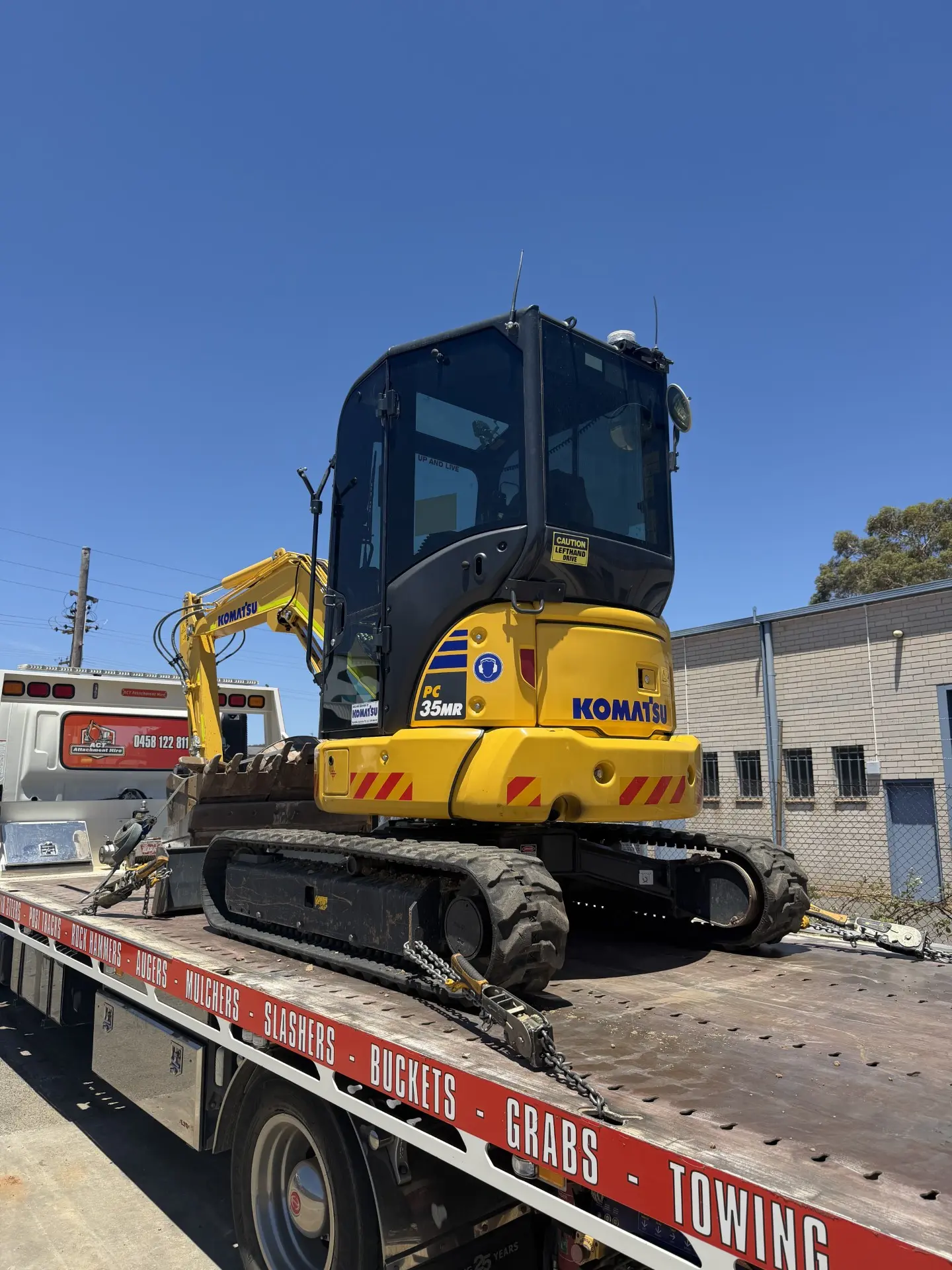 Excavator loaded on the tow truck, ready to go