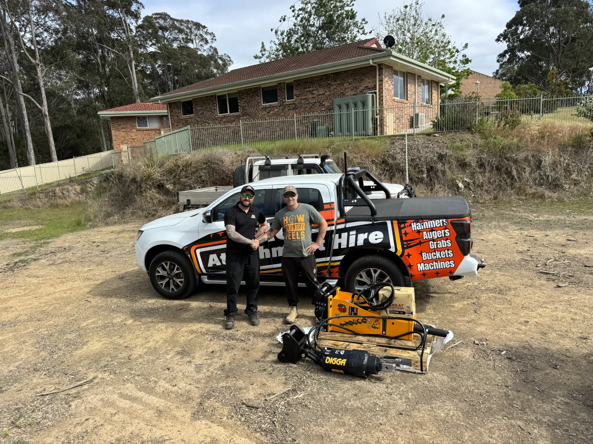 ACT Attachment Hire team with a post-hole borer on a rural block