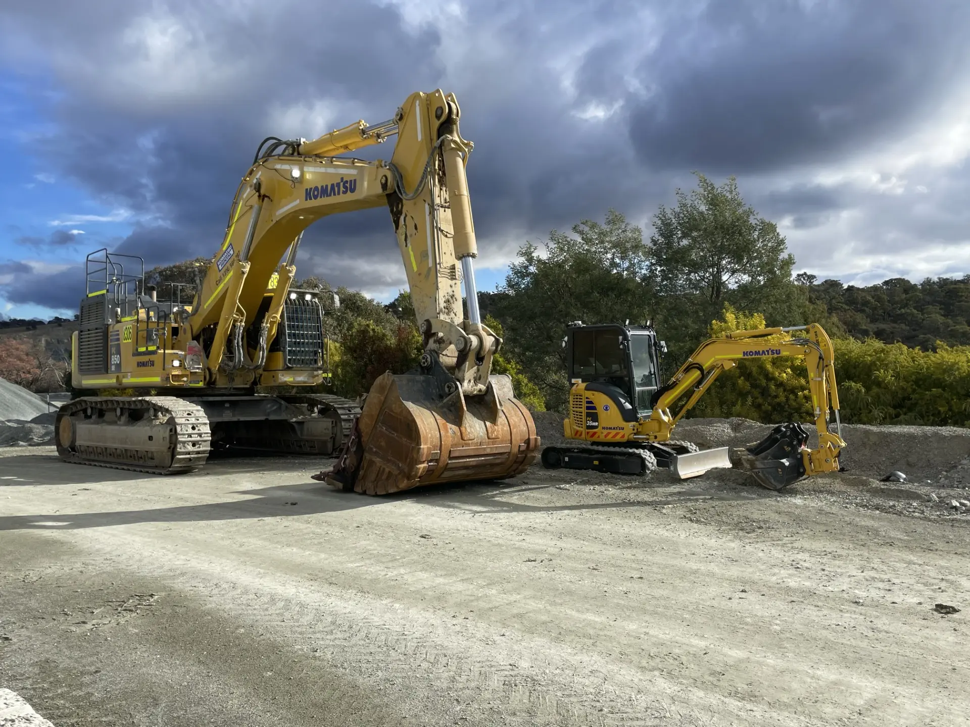 Excavator and wheel loader parked in the yard